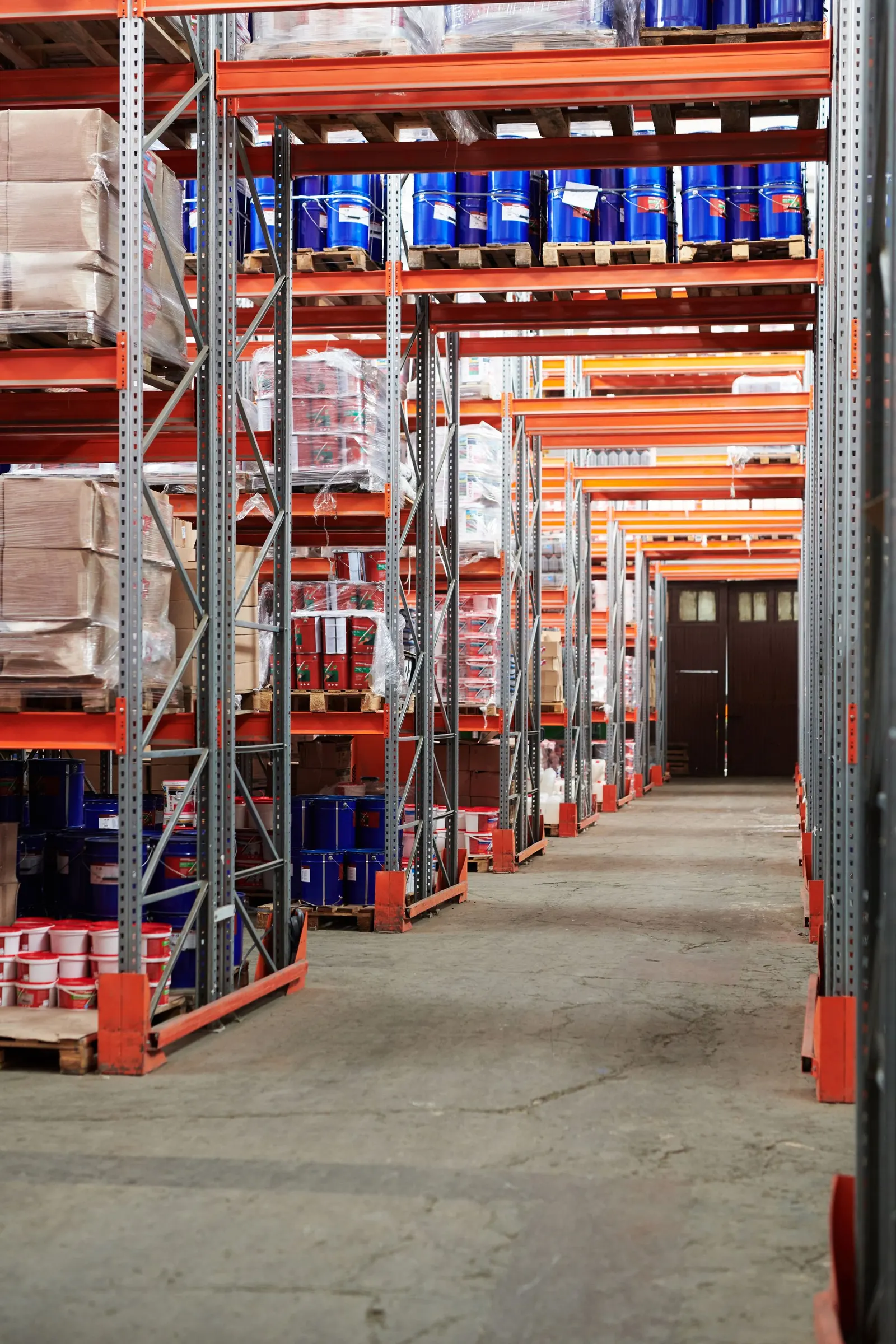 Pallet racks stacked with goods inside a distribution warehouse